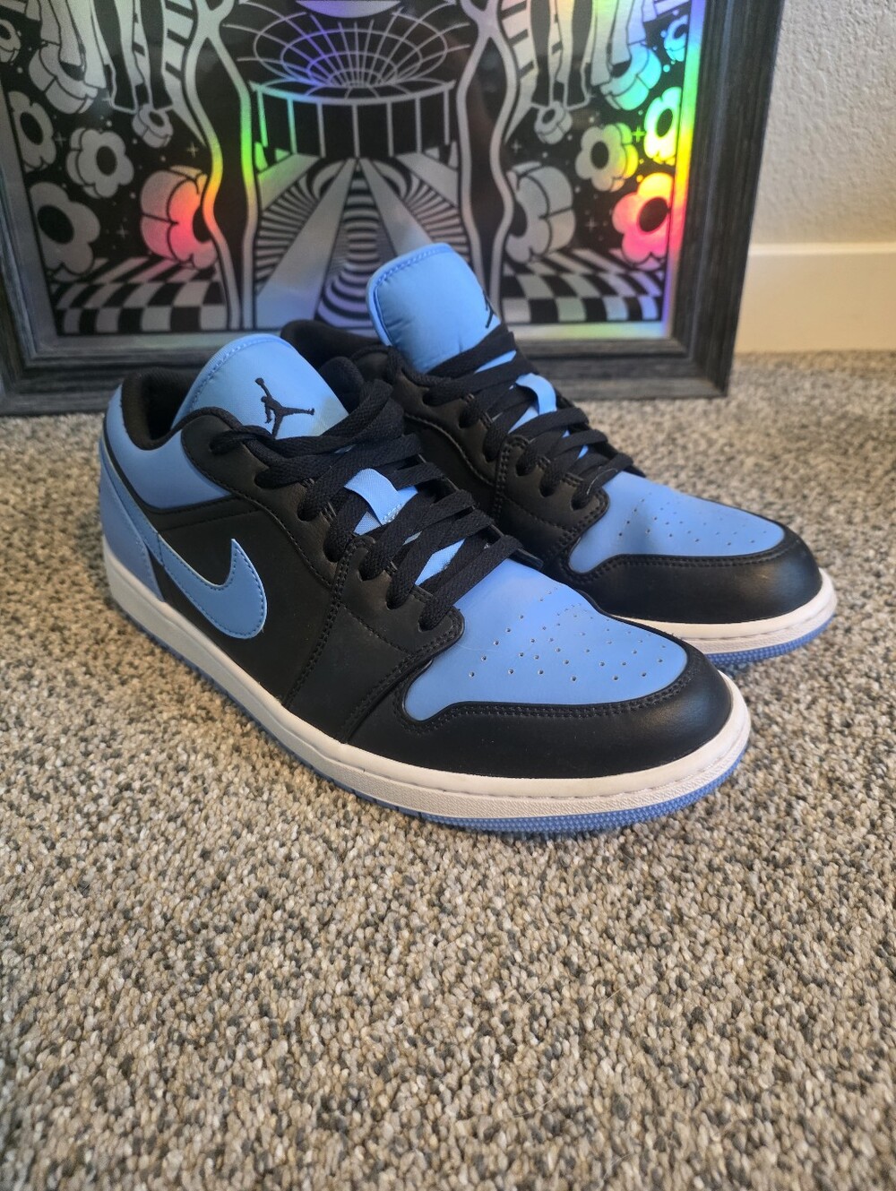 Nike Air Jordan 1 Low sneakers feature a black leather
